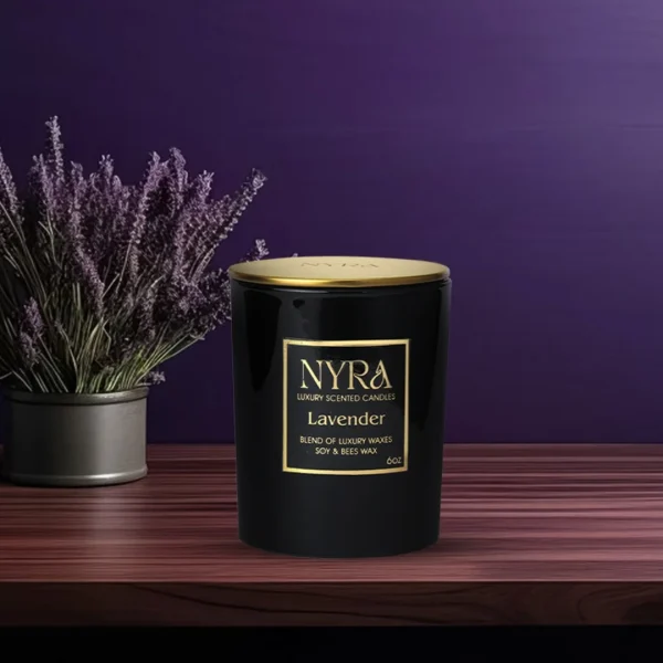 a black container with gold label next to a pot of lavender